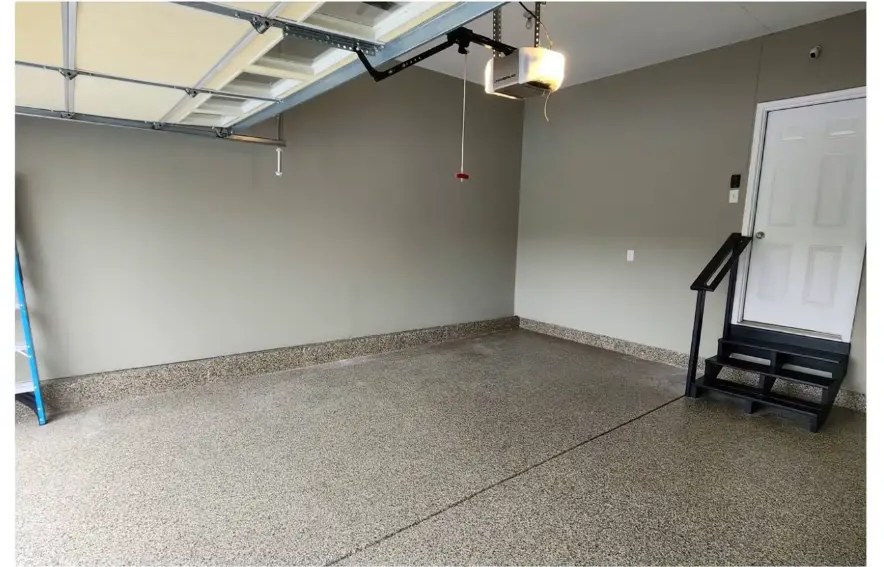 After garage painting: finished taupe-gray walls and clean epoxy floor